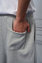 UNLIMITED MOTE Multi-Pleated Drawstring Raw-Hem Shorts