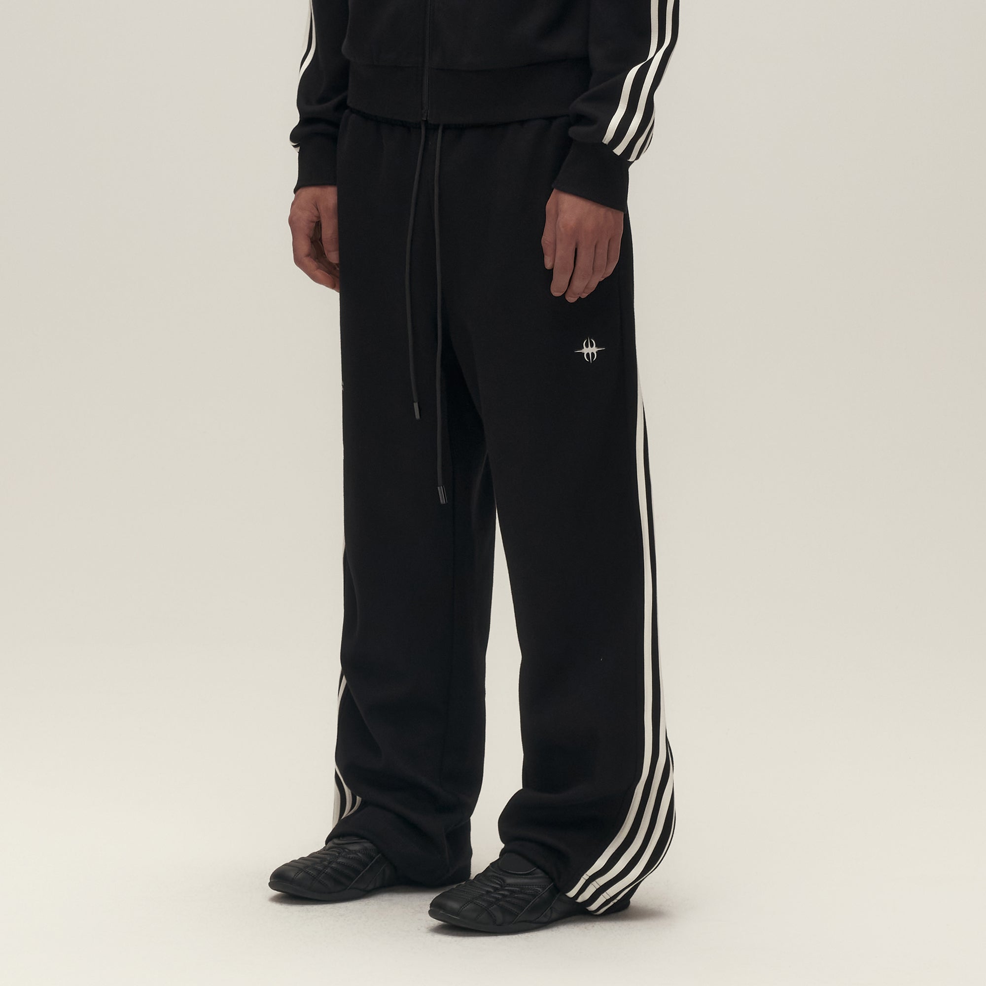 SAVAGEGROWTHWORLD Back-Arc Striped Graphic Track Pants