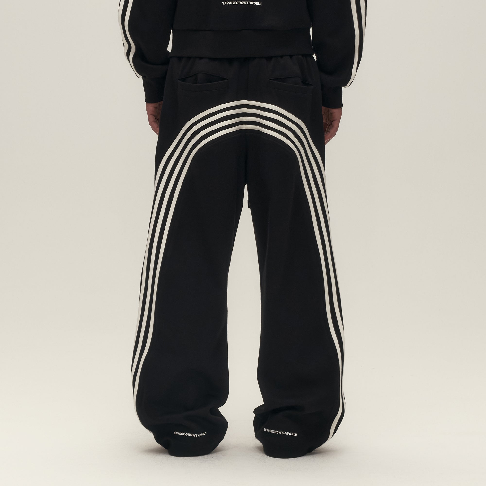 SAVAGEGROWTHWORLD Back-Arc Striped Graphic Track Pants