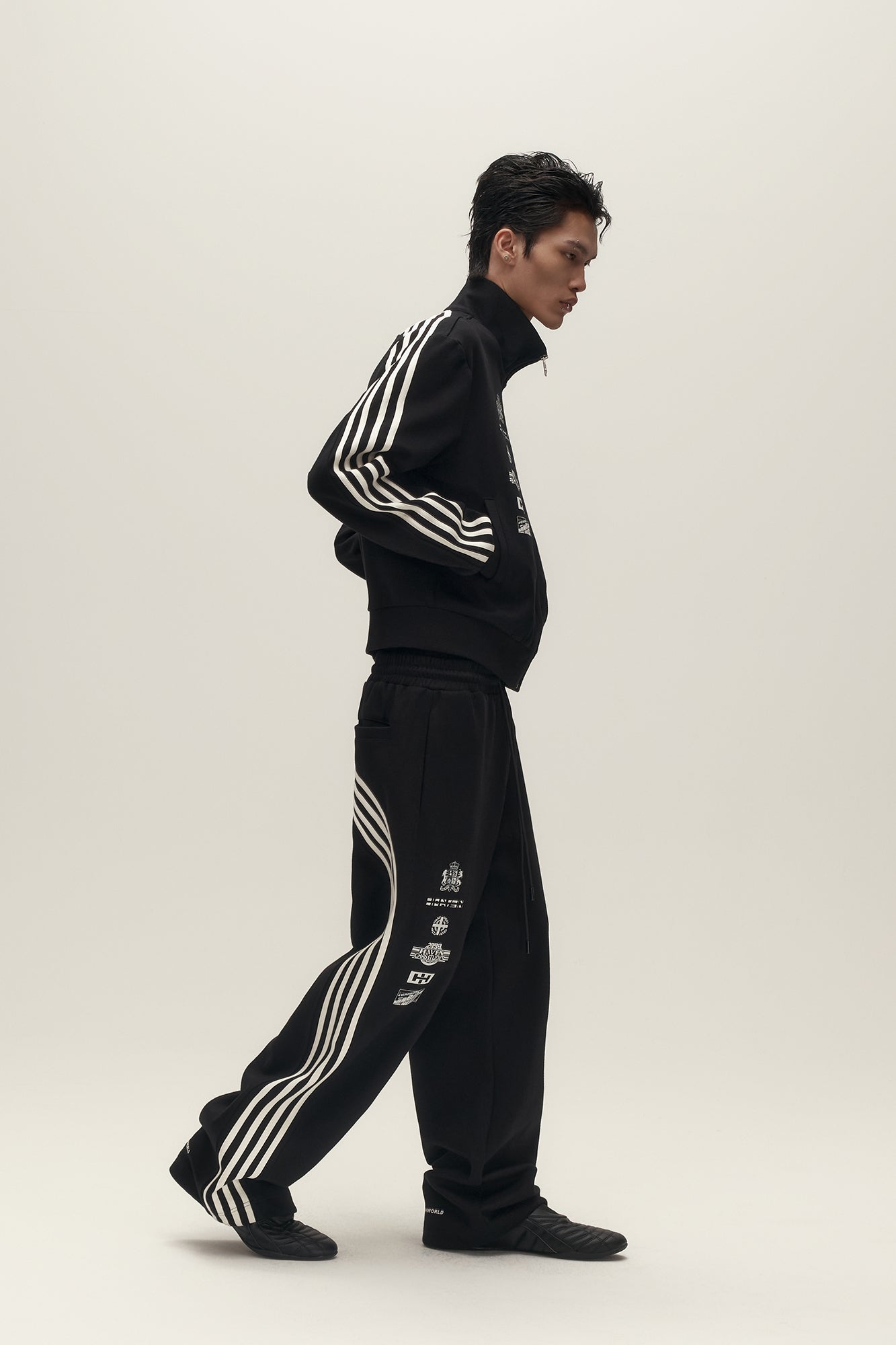 SAVAGEGROWTHWORLD Back-Arc Striped Graphic Track Pants