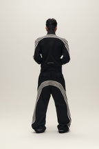 SAVAGEGROWTHWORLD Back-Arc Striped Graphic Track Pants