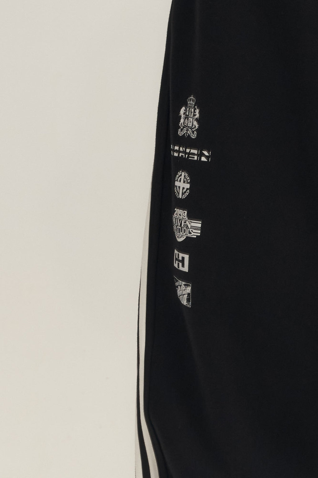 SAVAGEGROWTHWORLD Back-Arc Striped Graphic Track Pants