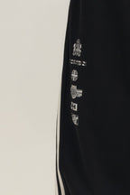 SAVAGEGROWTHWORLD Back-Arc Striped Graphic Track Pants