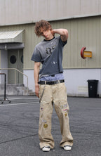 SAVAGEGROWTHWORLD Studded Distressed Graphic T-Shirt