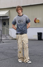 SAVAGEGROWTHWORLD Studded Distressed Graphic T-Shirt