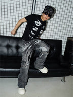 VINKID Distressed Grommet Strap Flared Jeans